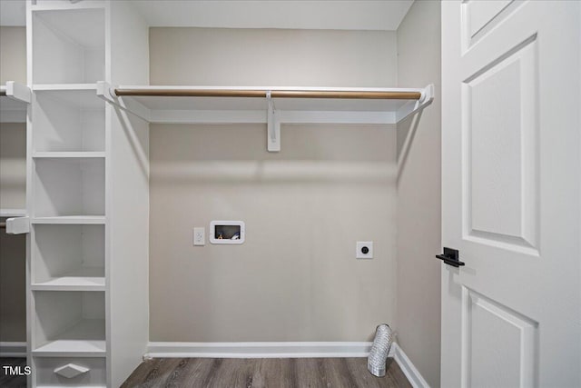 laundry area with dark hardwood / wood-style flooring, washer hookup, and electric dryer hookup