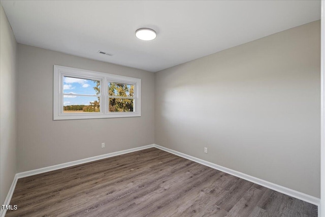 empty room with hardwood / wood-style floors