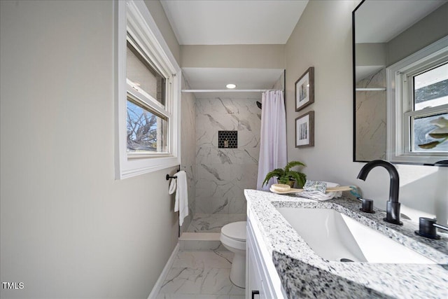 bathroom featuring vanity, curtained shower, and toilet