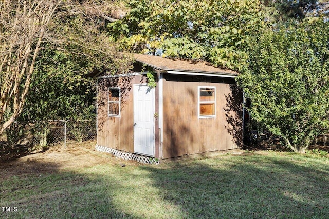 view of outdoor structure with a lawn