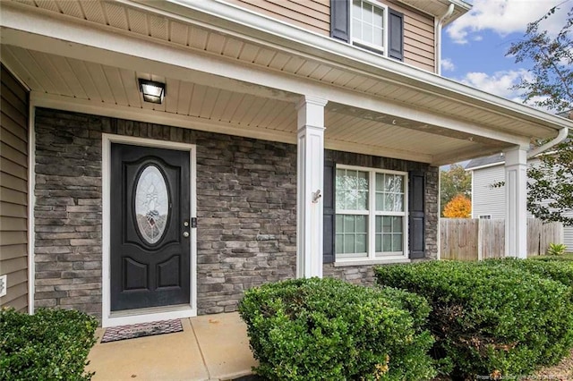 property entrance featuring covered porch