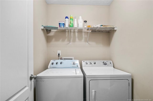 washroom featuring washer and dryer