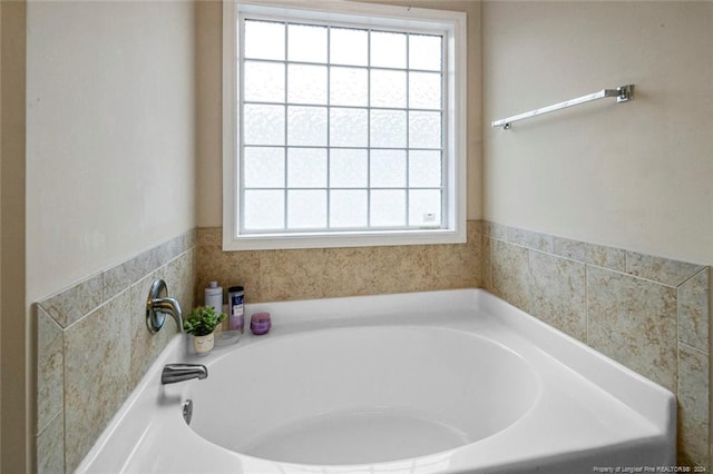 bathroom with a washtub