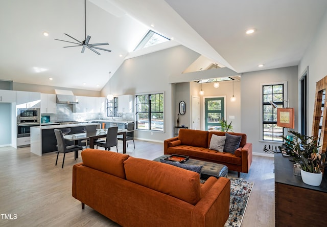 1414 Whippoorwill Ln, Chapel Hill, NC 27517 - living room featuring light wood-type flooring, plenty of natural light, high vaulted ceiling, and recessed lighting