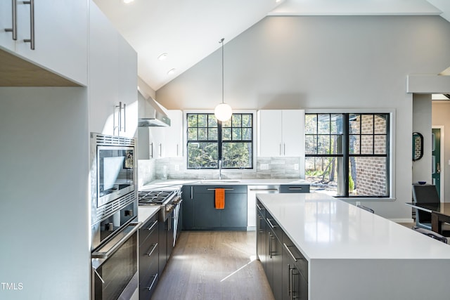1414 Whippoorwill Ln, Chapel Hill, NC 27517 - kitchen with appliances with stainless steel finishes, a sink, light countertops, white cabinetry, and light wood-style flooring