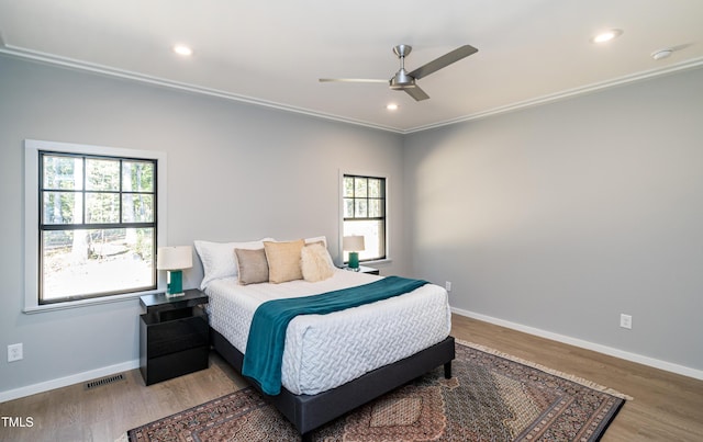1414 Whippoorwill Ln, Chapel Hill, NC 27517 - bedroom with multiple windows, baseboards, wood finished floors, and recessed lighting