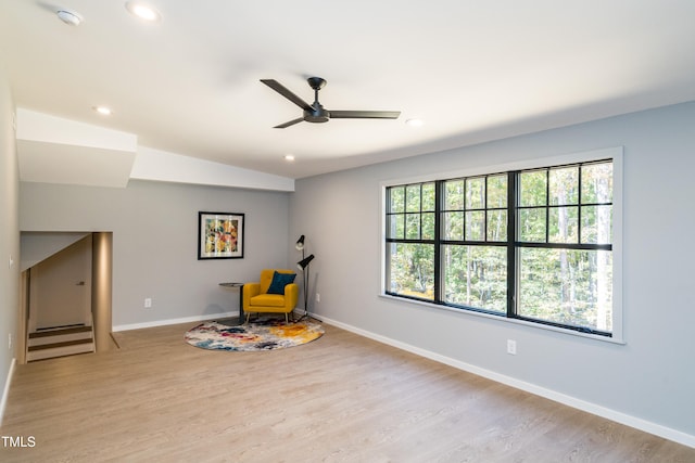 sitting room featuring ceiling fan and light hardwood / wood-style floors