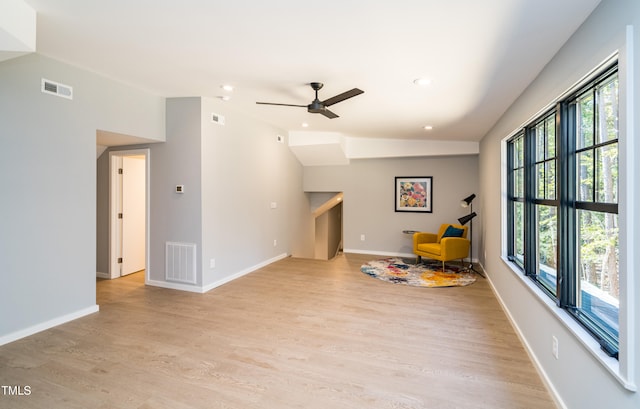 interior space featuring a wealth of natural light, ceiling fan, light hardwood / wood-style flooring, and vaulted ceiling