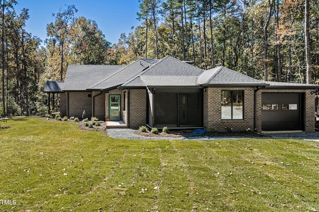 1414 Whippoorwill Ln, Chapel Hill, NC 27517 - view of front of property with an attached garage, a front yard, brick siding, and roof with shingles