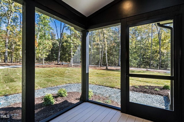 1414 Whippoorwill Ln, Chapel Hill, NC 27517 - unfurnished sunroom featuring lofted ceiling, plenty of natural light, and view of scattered trees