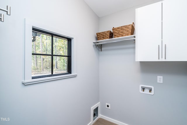 1414 Whippoorwill Ln, Chapel Hill, NC 27517 - laundry area featuring cabinet space, washer hookup, hookup for an electric dryer, baseboards, and wood finished floors
