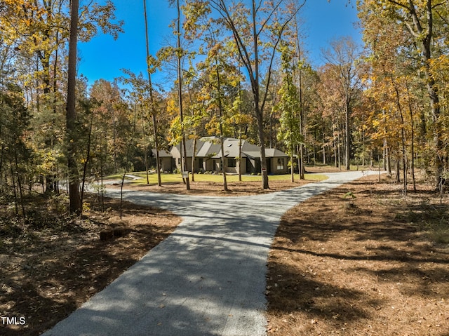 1414 Whippoorwill Ln, Chapel Hill, NC 27517 - view of community with asphalt driveway and a forest view
