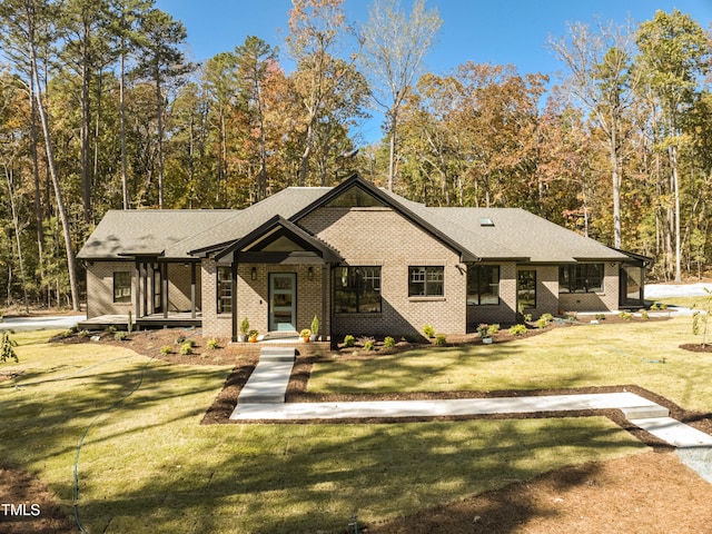 1414 Whippoorwill Ln, Chapel Hill, NC 27517 - view of front of home with brick siding and a front yard