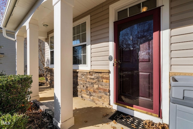 property entrance featuring covered porch