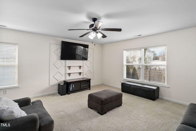 living room featuring light carpet and ceiling fan