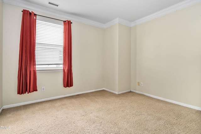 spare room with carpet floors and ornamental molding