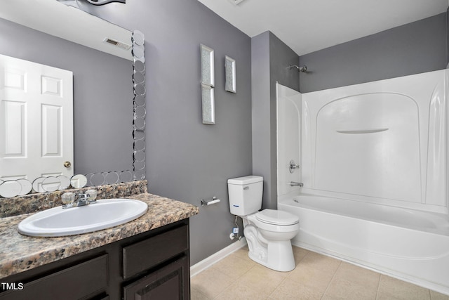 full bathroom featuring tile patterned floors, vanity, toilet, and washtub / shower combination