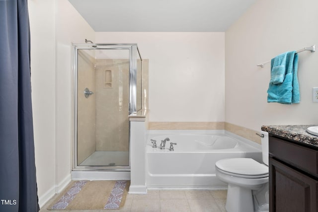 full bathroom with tile patterned flooring, vanity, independent shower and bath, and toilet