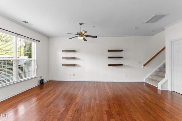 unfurnished living room featuring ornamental molding, ceiling fan, and dark hardwood / wood-style flooring