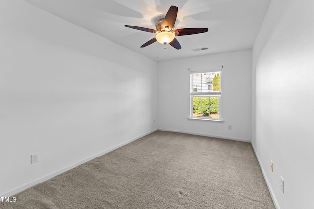 carpeted empty room with ceiling fan