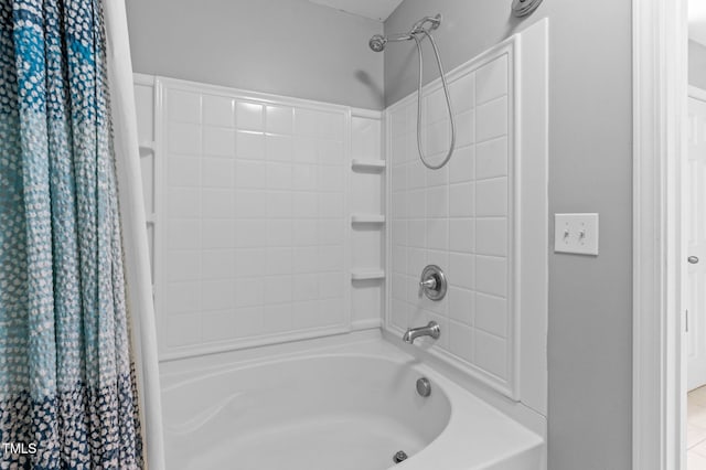 bathroom with shower / bath combo with shower curtain