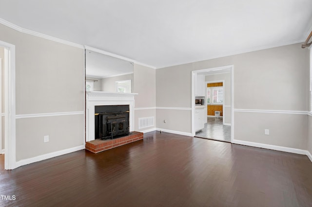 unfurnished living room with dark hardwood / wood-style floors and crown molding