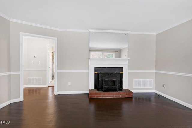 unfurnished living room featuring ornamental molding and dark hardwood / wood-style flooring