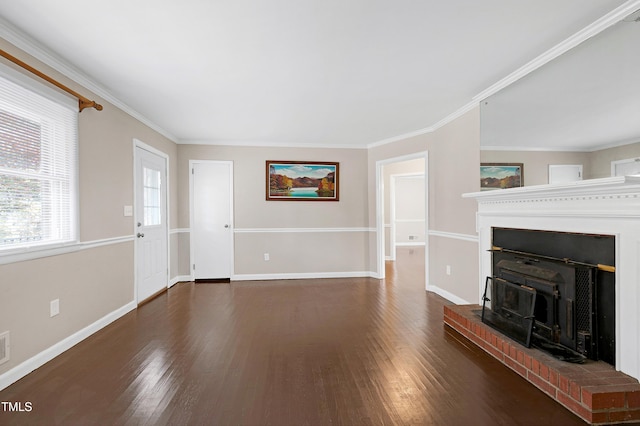 unfurnished living room featuring dark wood-type flooring, a brick fireplace, and crown molding