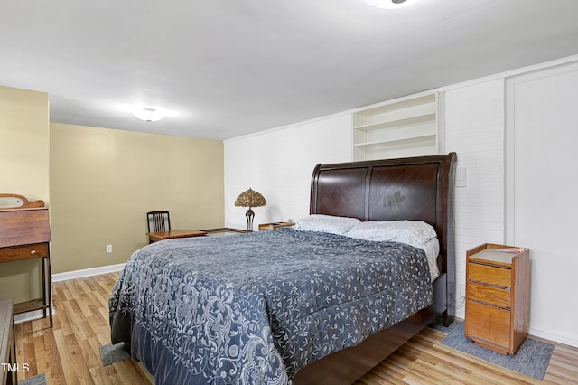 bedroom with hardwood / wood-style flooring