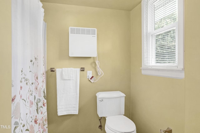 bathroom featuring toilet and plenty of natural light