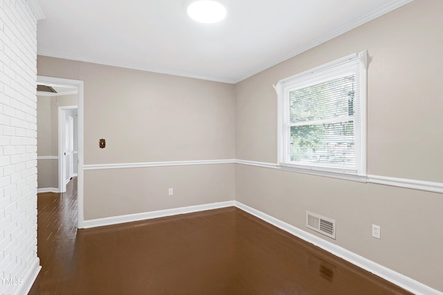 spare room with dark hardwood / wood-style floors and ornamental molding