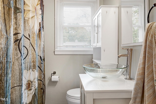 bathroom featuring vanity and toilet