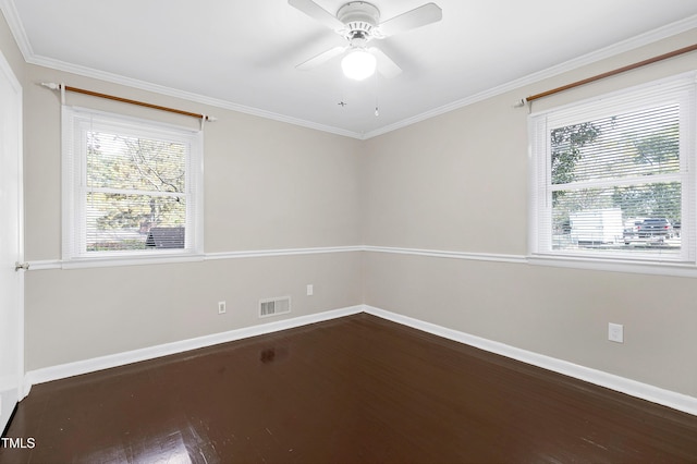 unfurnished room featuring dark hardwood / wood-style flooring, ceiling fan, and crown molding