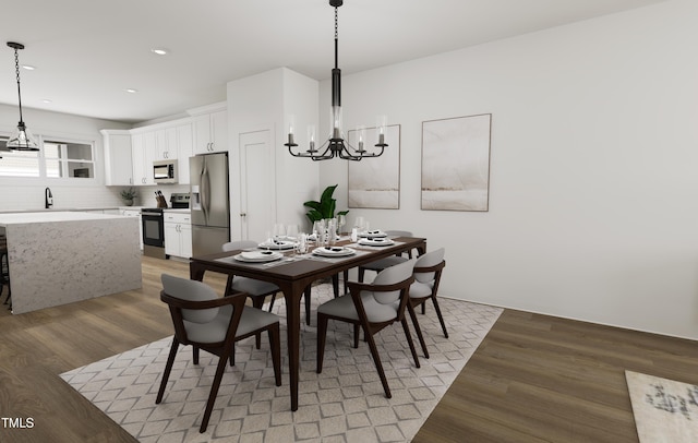 dining space with an inviting chandelier, recessed lighting, and light wood-style flooring