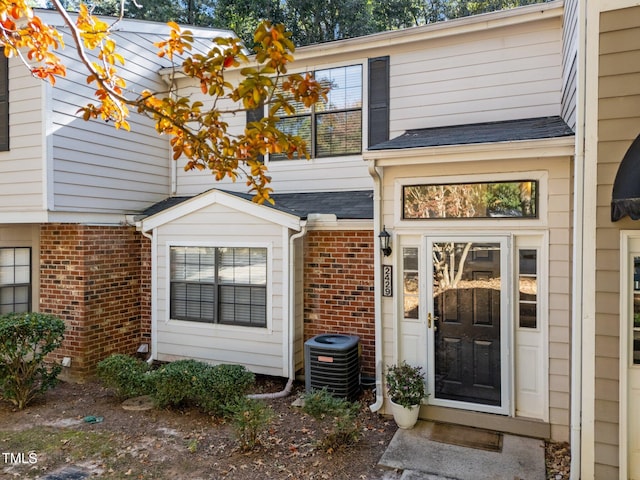 view of exterior entry featuring central AC