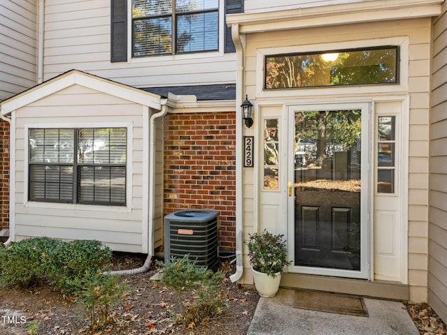 doorway to property with cooling unit