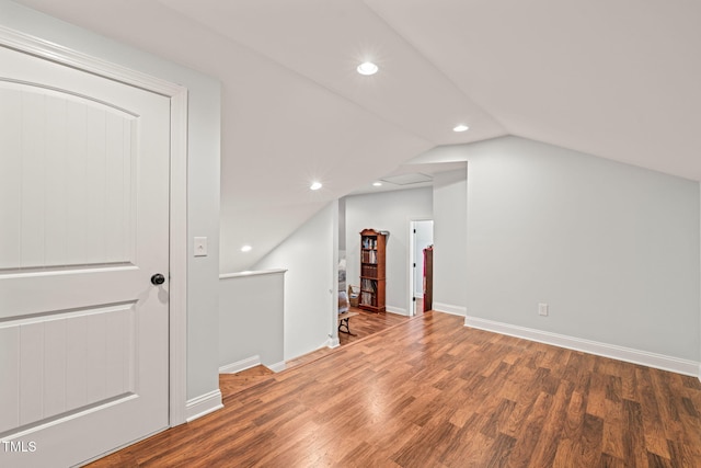 additional living space with lofted ceiling and wood-type flooring