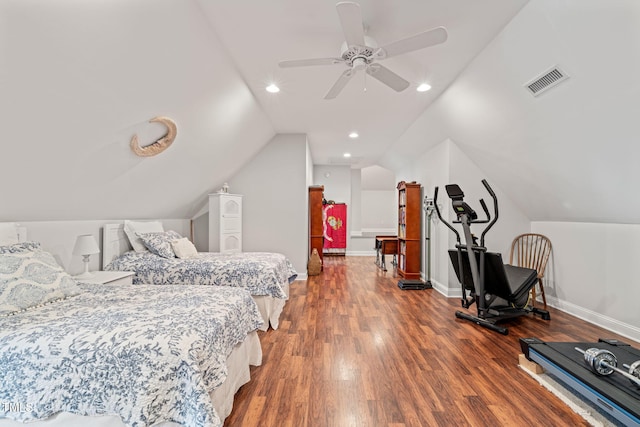 bedroom with ceiling fan, vaulted ceiling, and dark hardwood / wood-style flooring