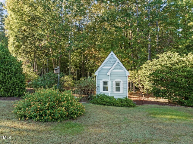 view of outbuilding with a lawn