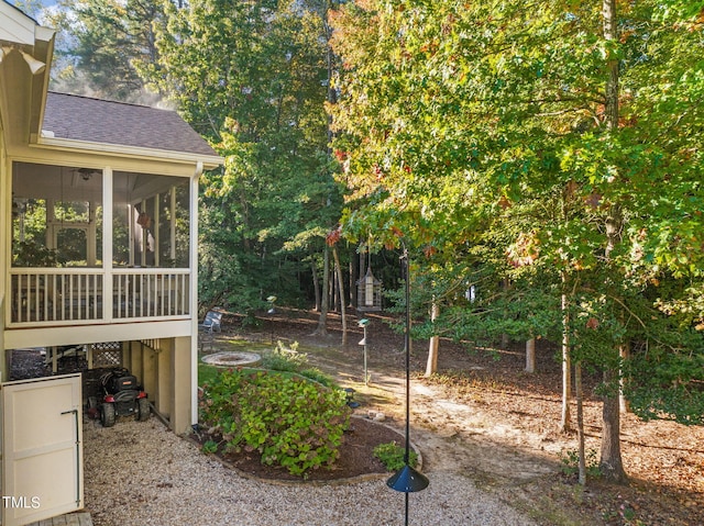 view of yard featuring a sunroom