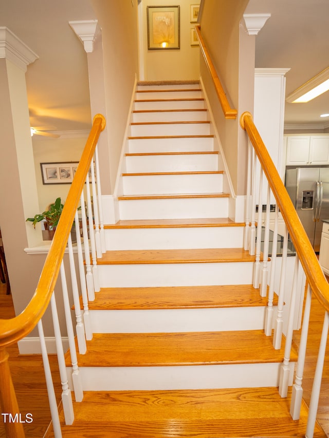 stairs with wood-type flooring