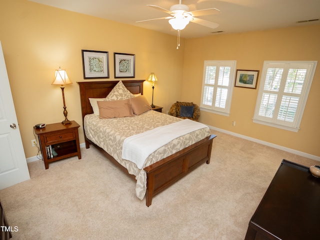bedroom featuring light carpet and ceiling fan