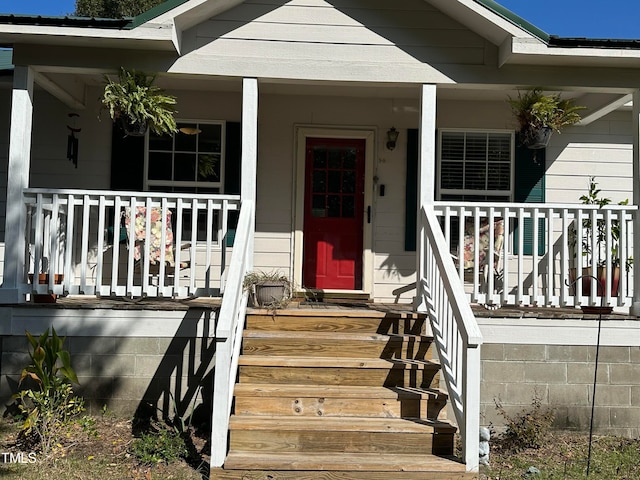 entrance to property with covered porch