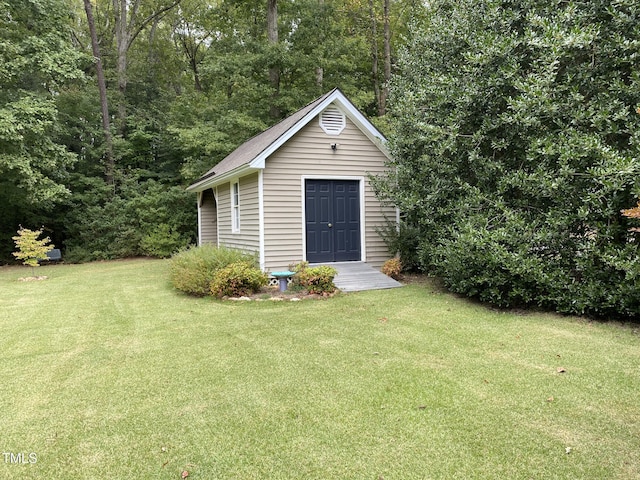 view of outdoor structure with a yard