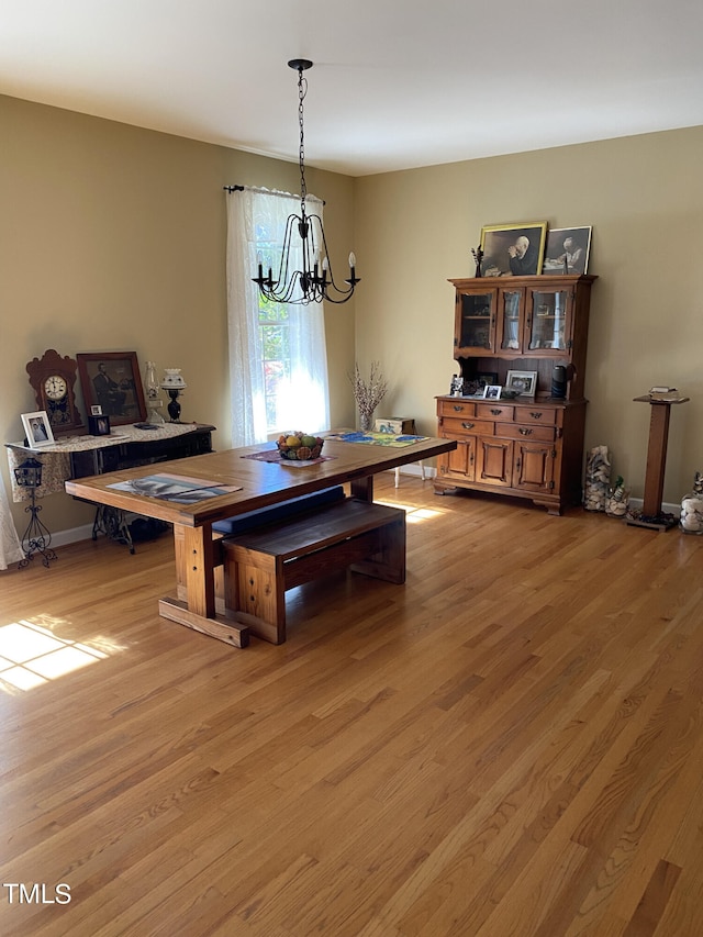 dining room featuring a chandelier and light hardwood / wood-style flooring