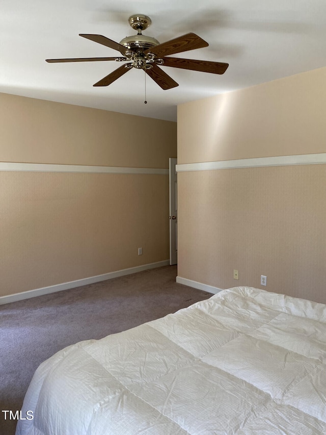 unfurnished bedroom with carpet flooring and ceiling fan