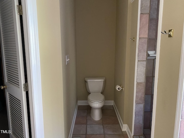 bathroom featuring toilet and tile patterned floors