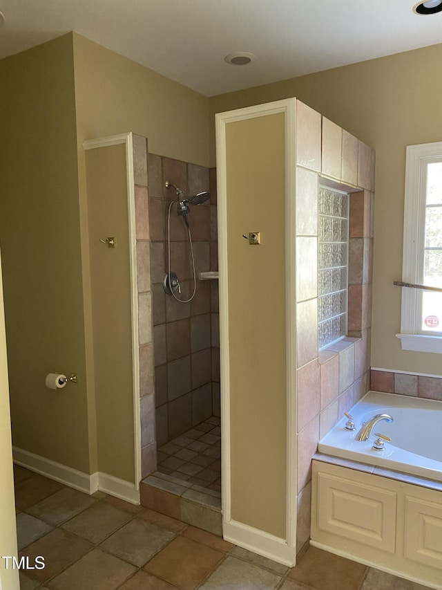 bathroom with tile patterned floors and plus walk in shower