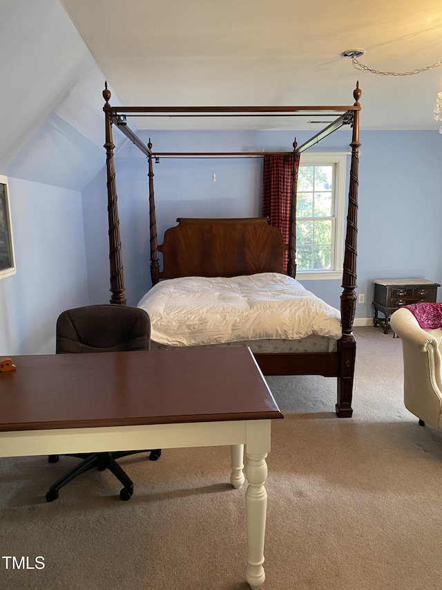 carpeted bedroom with vaulted ceiling