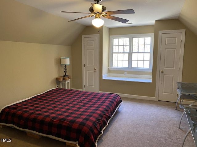 carpeted bedroom featuring vaulted ceiling and ceiling fan